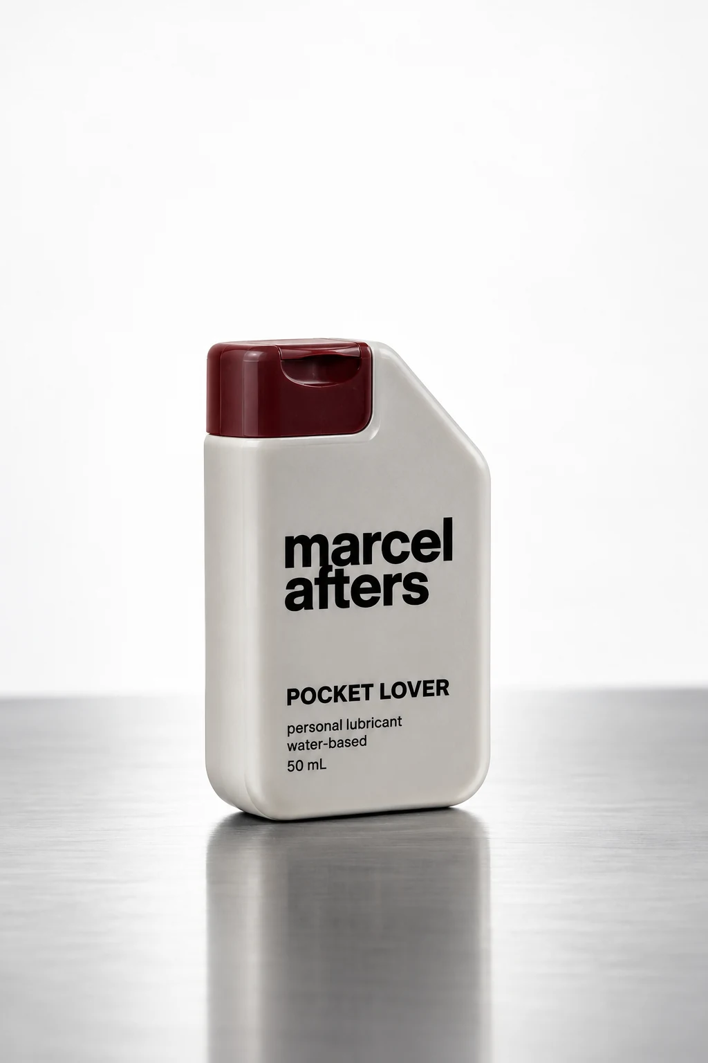 Pocket Lover concept: a compact ivory Marcel Afters bottle with a burgundy cap, labelled water-based personal lubricant, 50 mL.